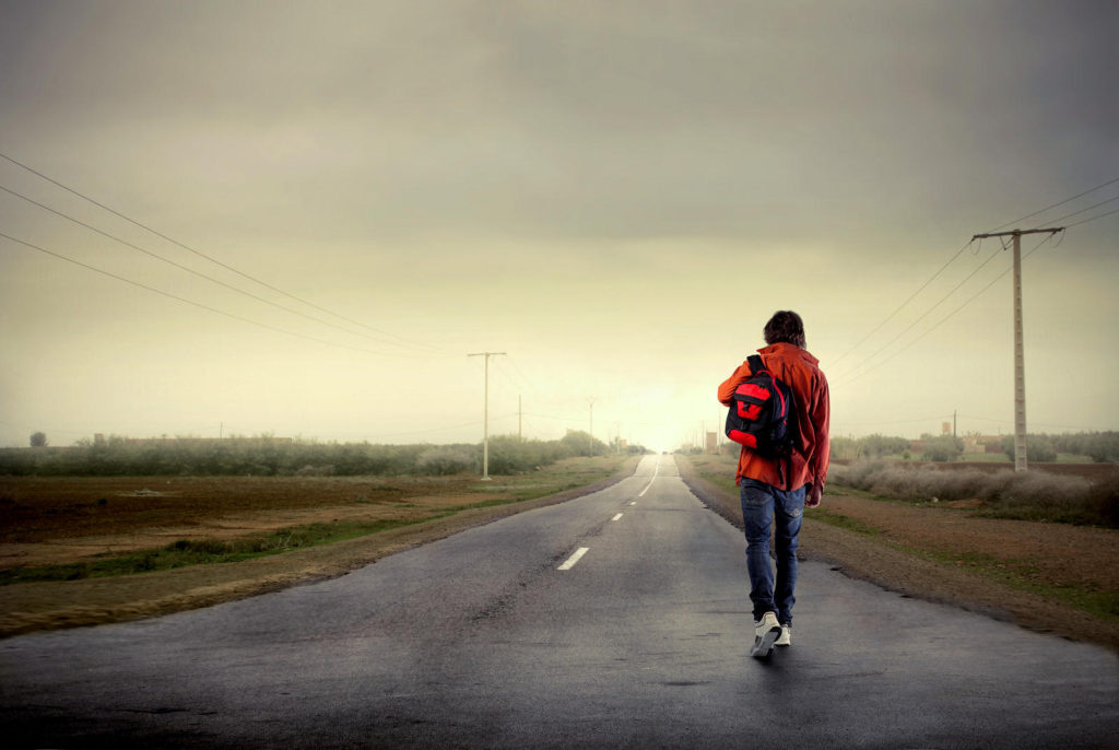bigstock-young-man-walking-on-a-country-13798088
